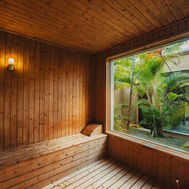 Timber sauna at Shanti Maurice with a window onto the spa garden