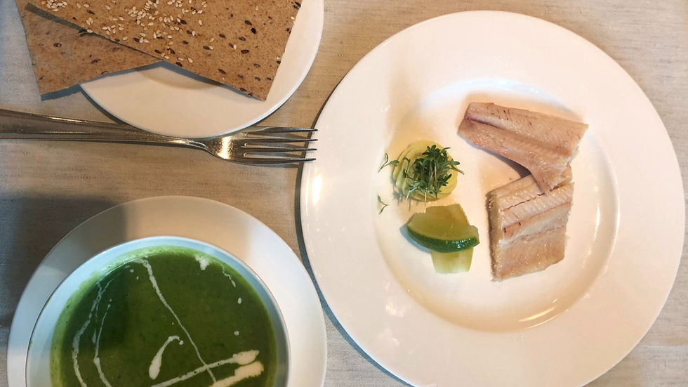 Mayr diet meal at Park Igls featuring green soup, fish, rye crispbread and fresh herbs