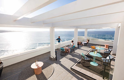 Guests relaxing on the Atlantic rooftop terrace at Océano Health Spa Hotel Tenerife