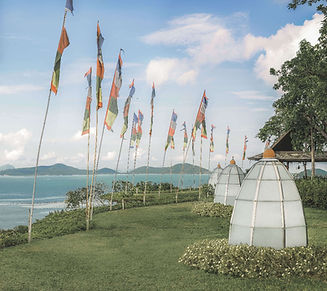 Flags and spiritual ambience at Kamalaya’s coastal sanctuary