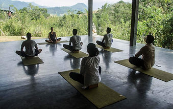 Morning yoga session at Santani Wellness Resort with open-air mountain views