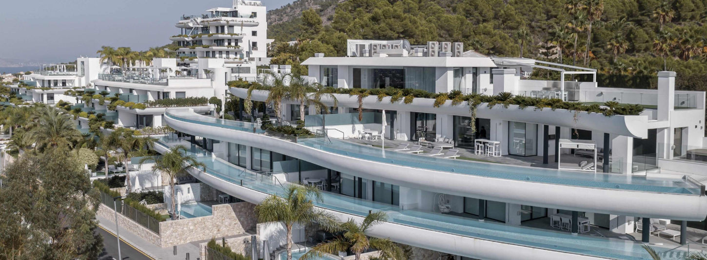 SHA Wellness Clinic exterior view with mountain backdrop in Alicante, Spain