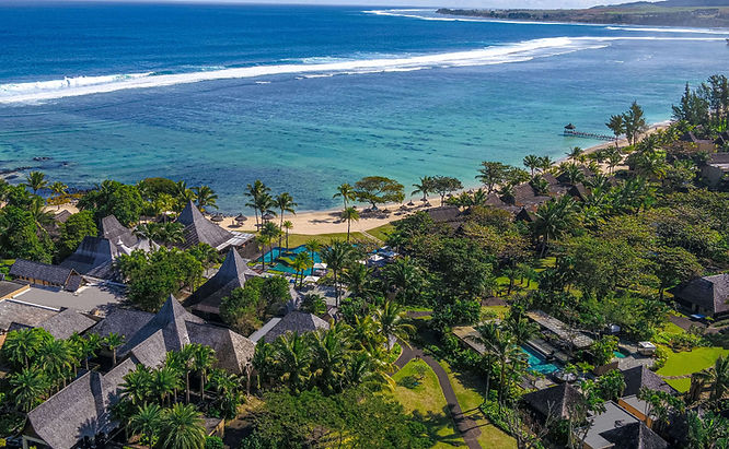 Drone view of Shanti Maurice Wellness Resort set along Mauritius’ coral-fringed coastline.