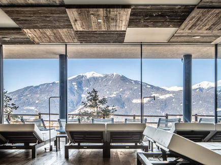 Relaxation lounge with panoramic mountain views at My Arbor hotel in Italy