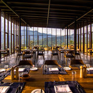 Glass-walled restaurant seating forty on the first floor at Santani