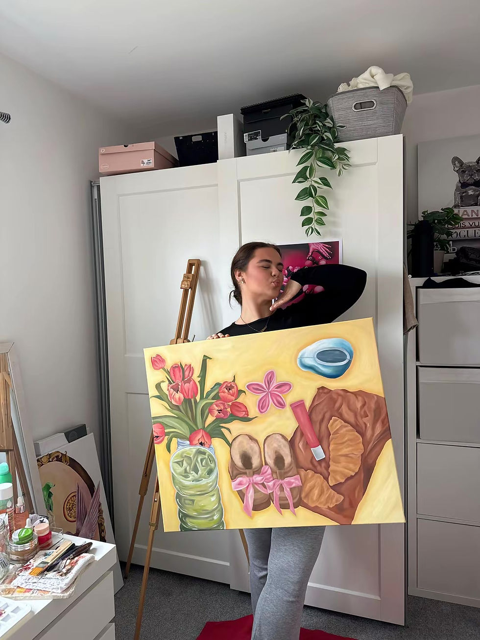 nikki holding her oil painting 'girl abundance'