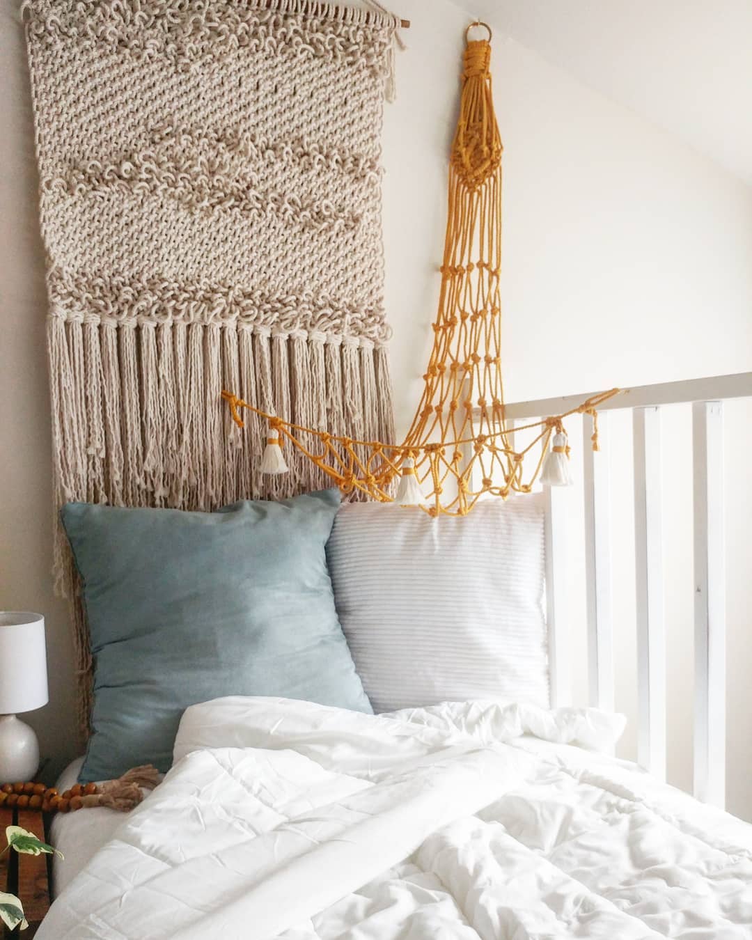 Finished macramé toy hammock in a child's room