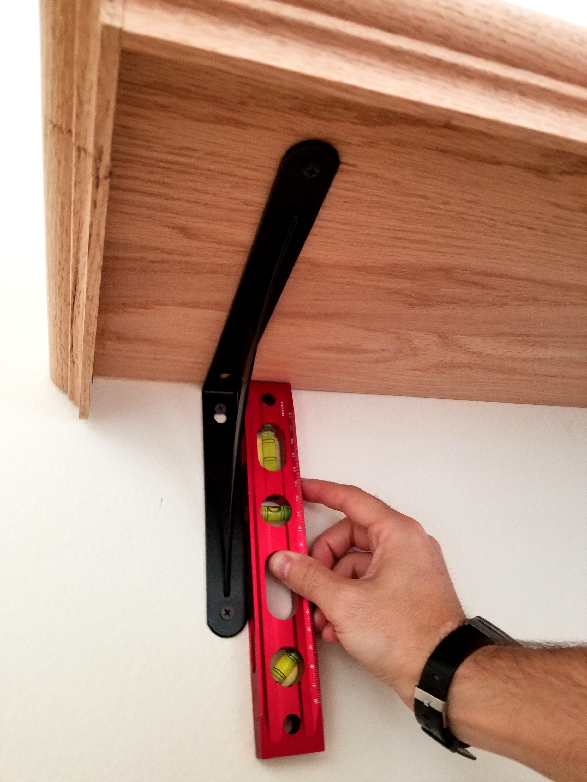 Locating studs and marking bracket positions