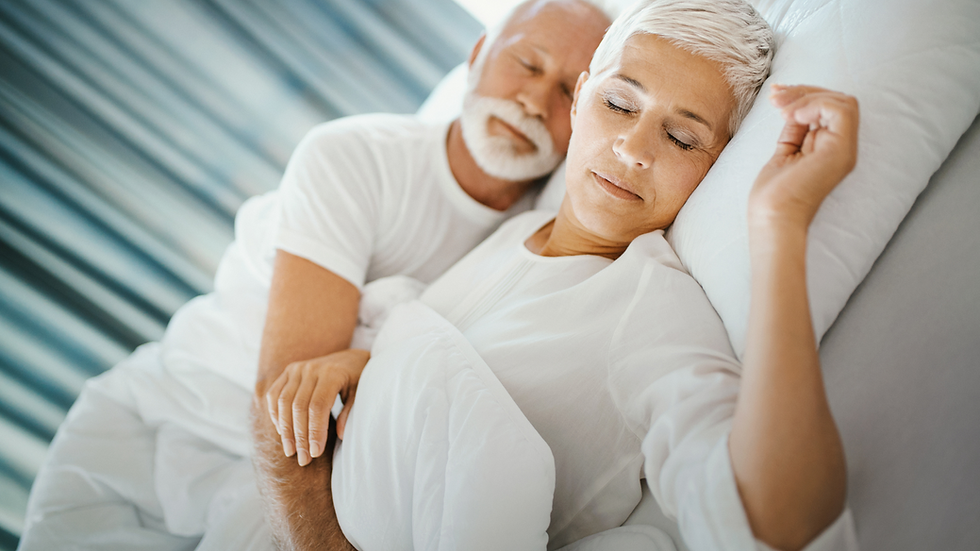 older couple asleep in bed