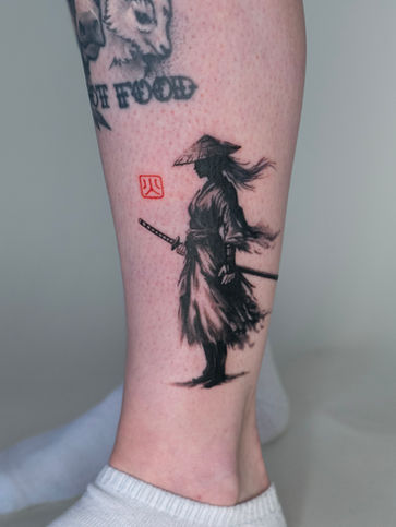 Sumi style female samurai tattoo on ankle