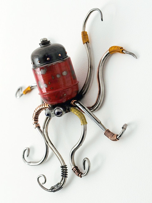 side view of recycled metal octopus sculpture by artist Simon Treseder
