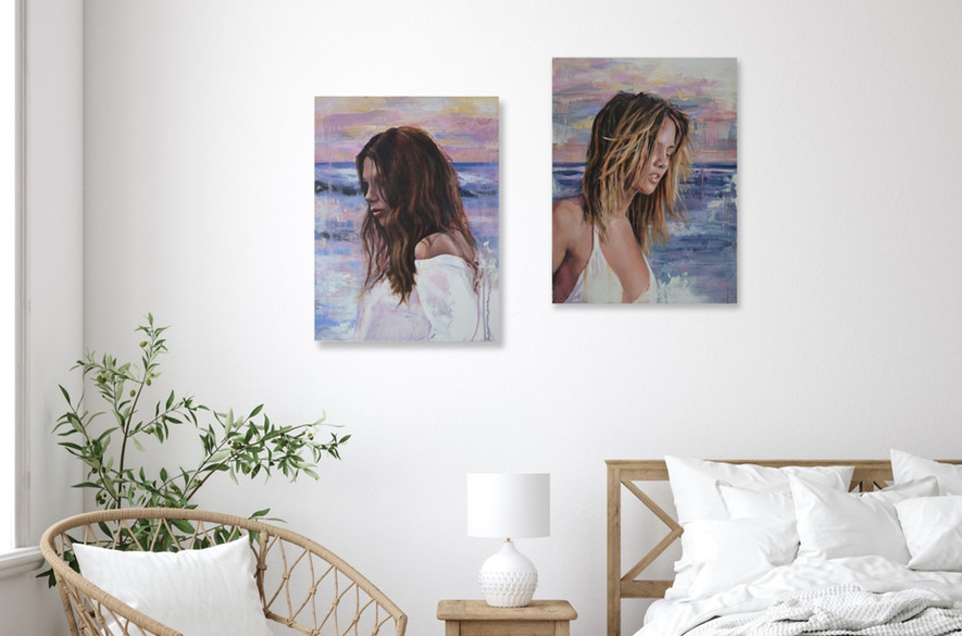 matching print set of paintings of women at the beach, displayed in a bedroom