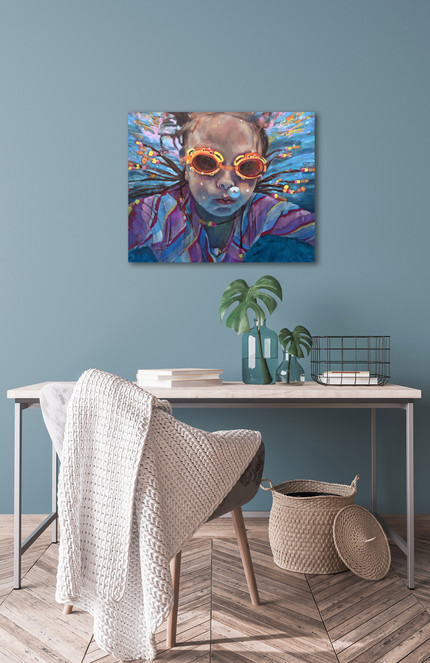 painting of a young girl swimming underwater wearing goggles. Painting hanging in home interior