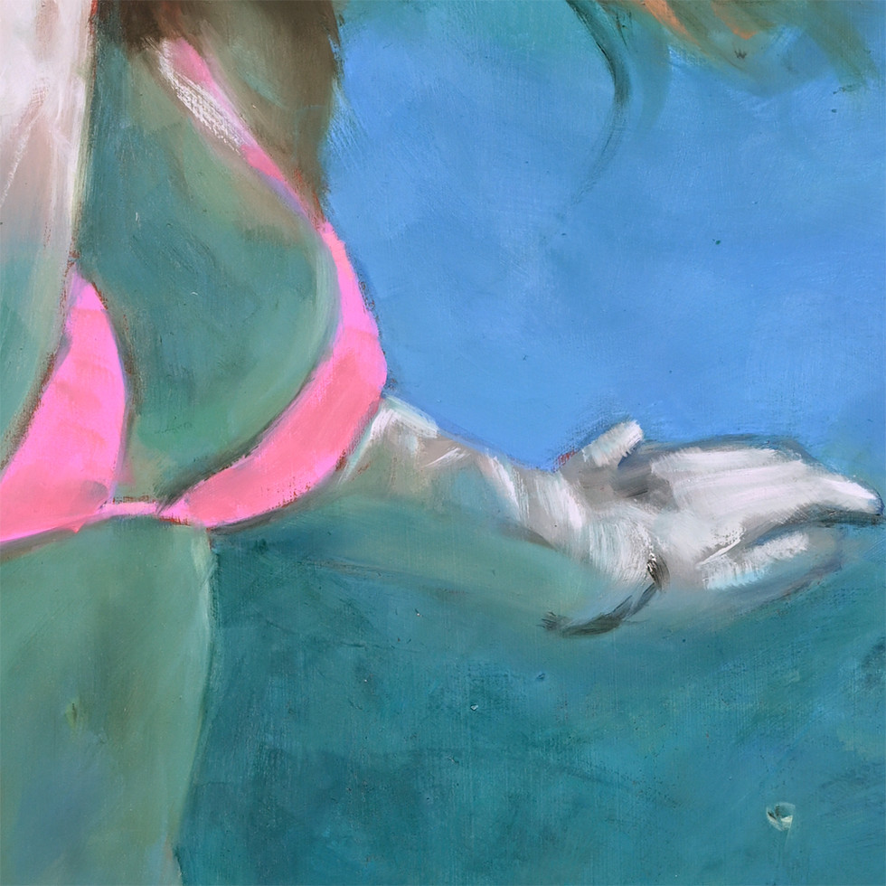 Woman's arm and hand reaching out in blue water, wearing a pink bikini top