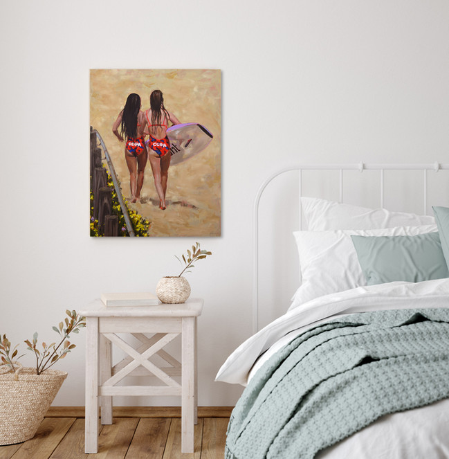 Displayed in a coastal bedroom is a painting of two girls walking on the sand in Copa surf club swimsuits by Naomi Veitch