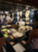 Merch table worker selling merch