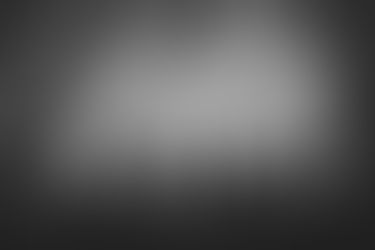 Photo of phones in the air at a concert.