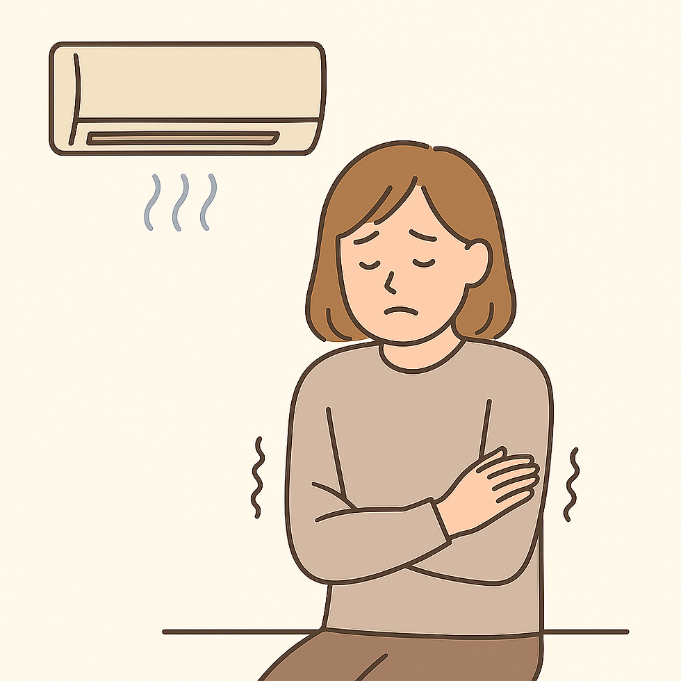 冷房で体が冷えている女性