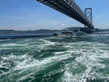 The Naruto Whirlpools, occurring in the Naruto Strait at the eastern end of the Seto Inland Sea, are among the largest whirlpools in the world.