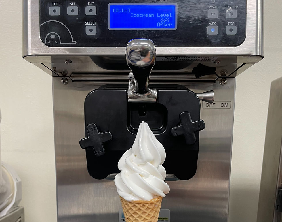vanilla ice cream cone in front of icetro soft serve machine