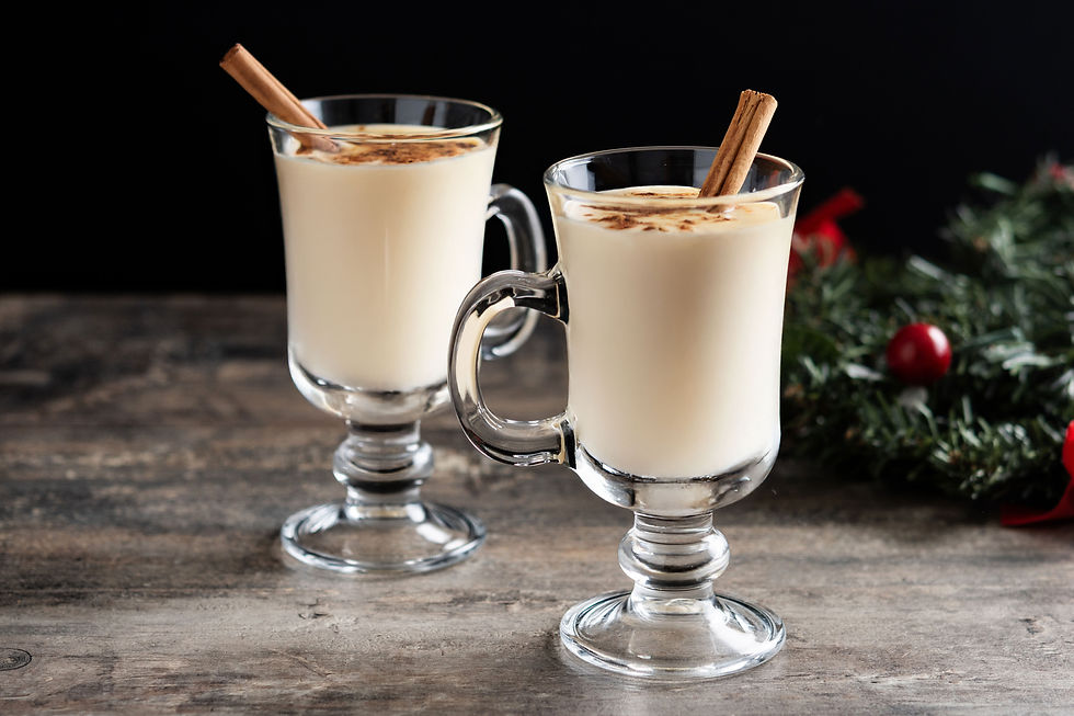 frozen eggnog cocktails in glass mugs with cinnamon sticks