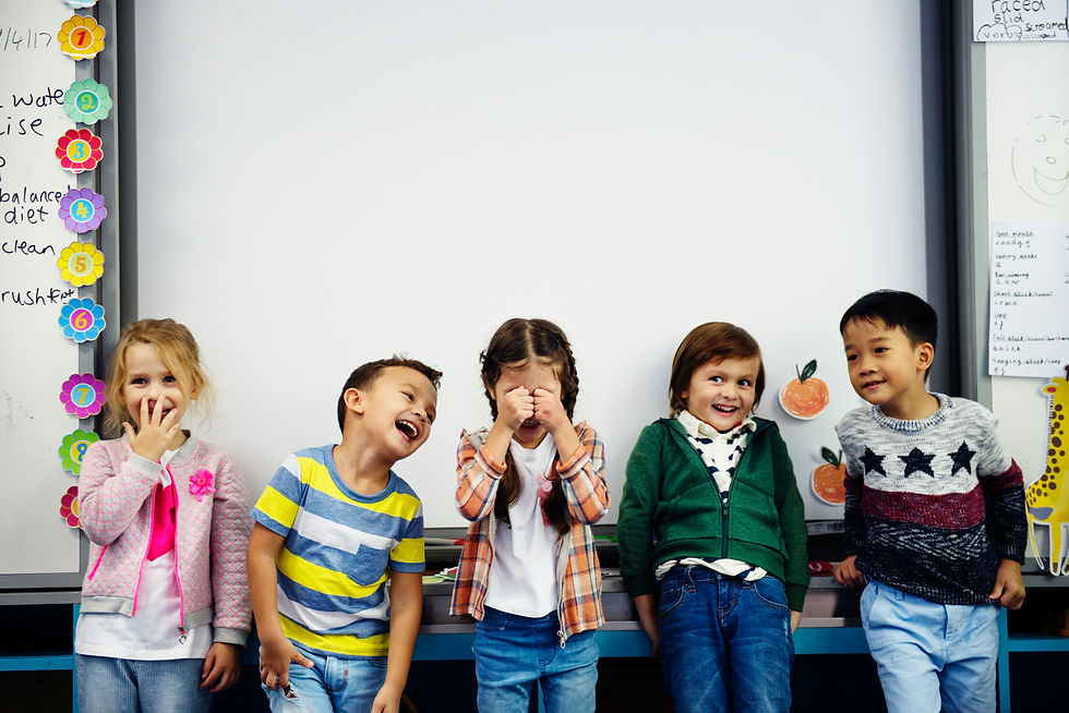 kids lined up in classroom making funny faces