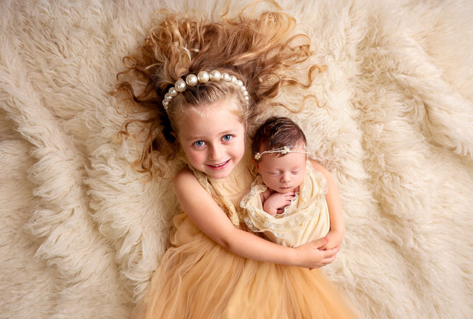 Capturing Magical Moments: Big Sister Shines During Newborn Photoshoot Adventure