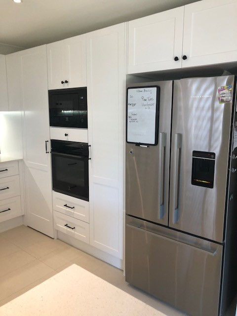 Shaker kitchen with a walkin blind corner pantry