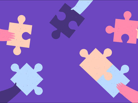 Hands holding puzzle pieces coming together, representing how short individual messages combine to create a personal group video.