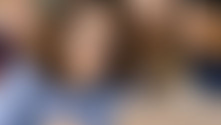 Teacher watching a video with students during a classroom appreciation moment.