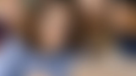 Teacher watching a video with students during a classroom appreciation moment.