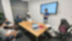Student delivering a weekly pitch during entrepreneurship classes for teens at Launchpad Juniors.