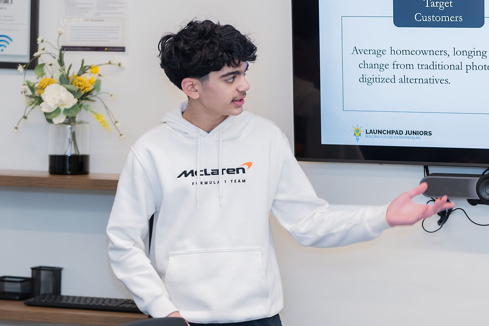 Eye-level view of a teenager working on a robotics project at a desk with tools and parts