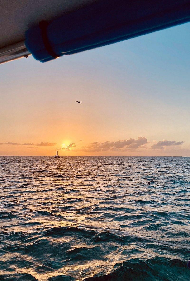 Golden sunset over the ocean from a boat