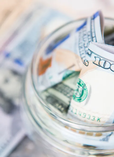 Dollar Bill in Jar.webp