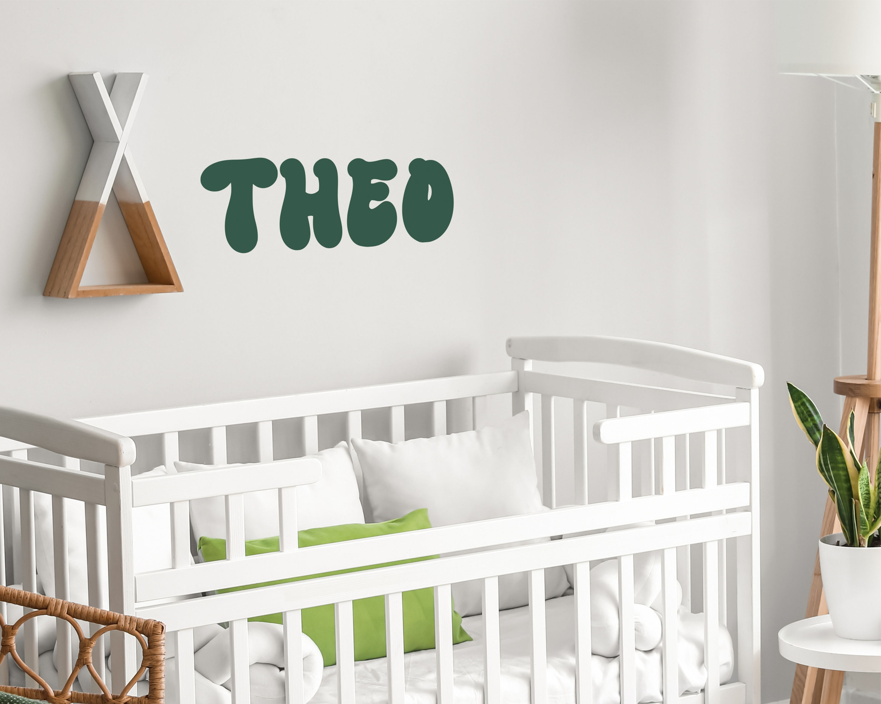 Green 'THEO' name wall decal in nursery
