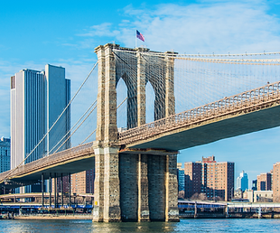 Ground-level view of the Brooklyn Bridge in New York City, New York.