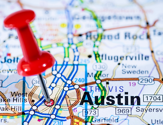 Map showing major highways (such as US-290) with a red pin set on Austin, Texas.
