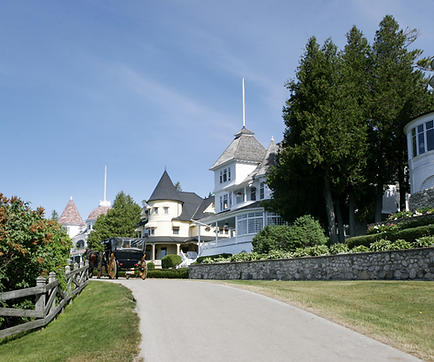 A roadway and beautiful Victorian homes on Mackinac Island, Michigan.