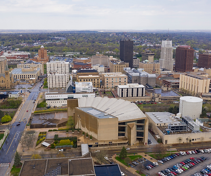 Aerial view of various apartment, church, commercial, condominium, office, and parking garage buildings in Akron, Ohio.