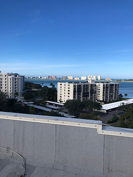 Rooftop view of multiple high-rise condominium buildings and the intracoastal in Belleair, Florida.