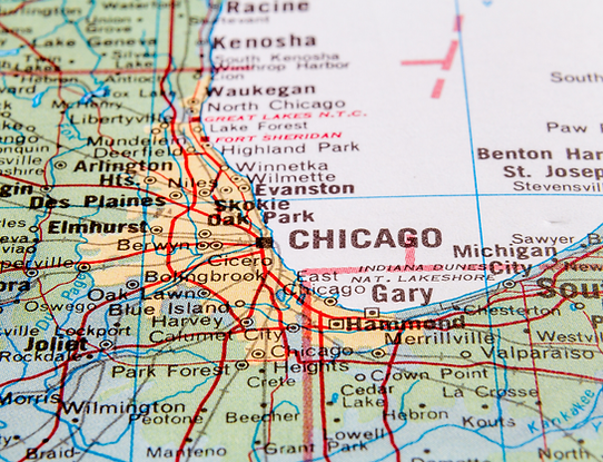 Paper map showing cities, neighborhoods, and roads throughout Chicago, Illinois.