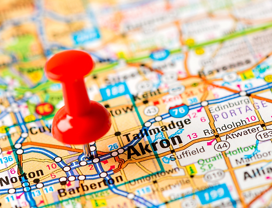 Map showing major roadways, such as Interstate 76, with a red pin at the center of Akron, Ohio.