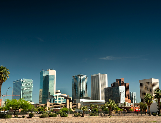 Cityscape view of multiple high-rise condominium and office buildings as well as a commercial parking garage.