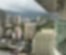 View of downtown Honolulu, HI from the balcony of a high-rise building.