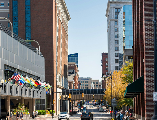 Street view of numerous commercial buildings in downtown Grand Rapids, Michigan, including Hyatt Place and the Grand Rapids Community College in the background.