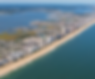 Aerial view of beachside condominium buildings along Ocean Beach, Maryland.