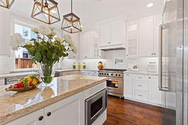 White Kitchen Remodel with Stainless Steel Appliances