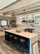 Industrial Kitchen with Wood Beams