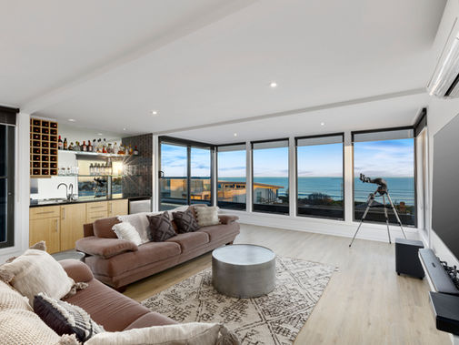 Upstairs outdoor lounge and deck overlooking the ocean at Dare to Dream Ocean Grove